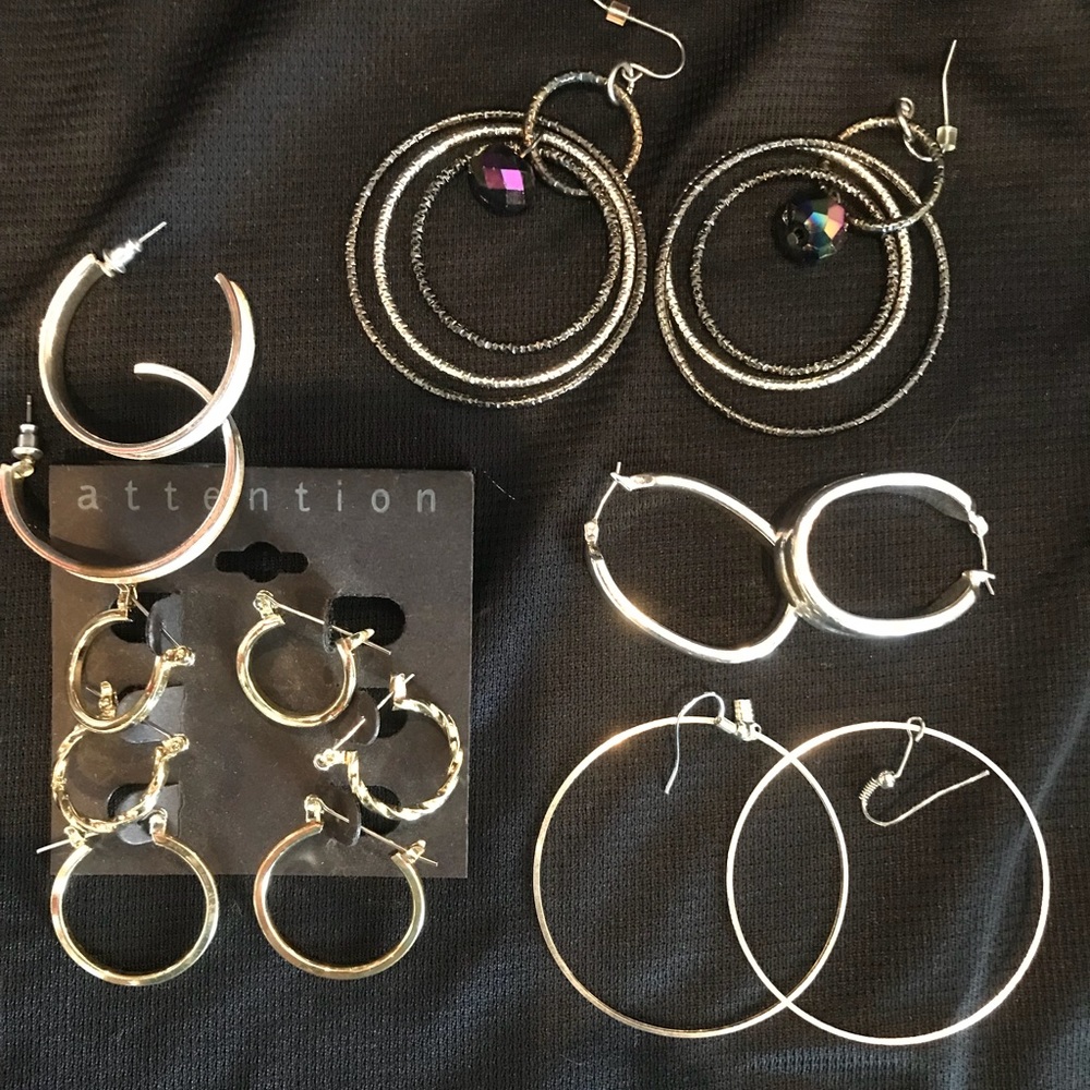 Various sizes of silver hoop earrings